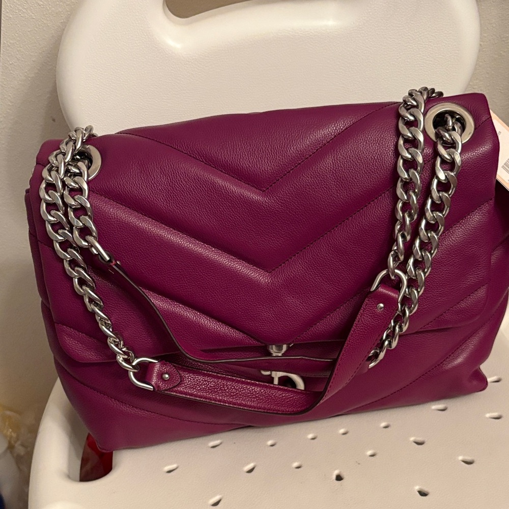 . Brand new Rebecca Minkoff handbag, purple/burgandy color.